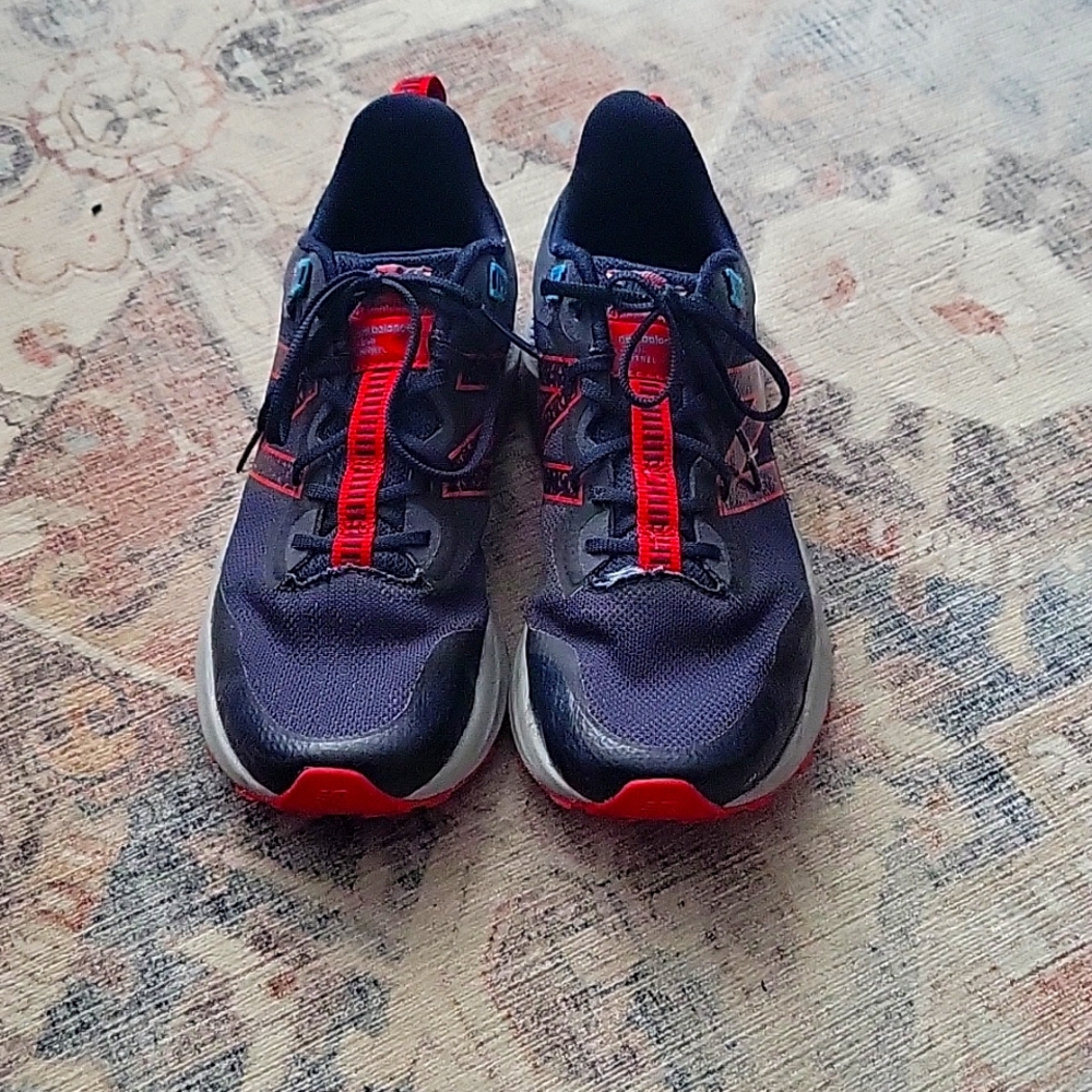 Red and black new balance sneakers